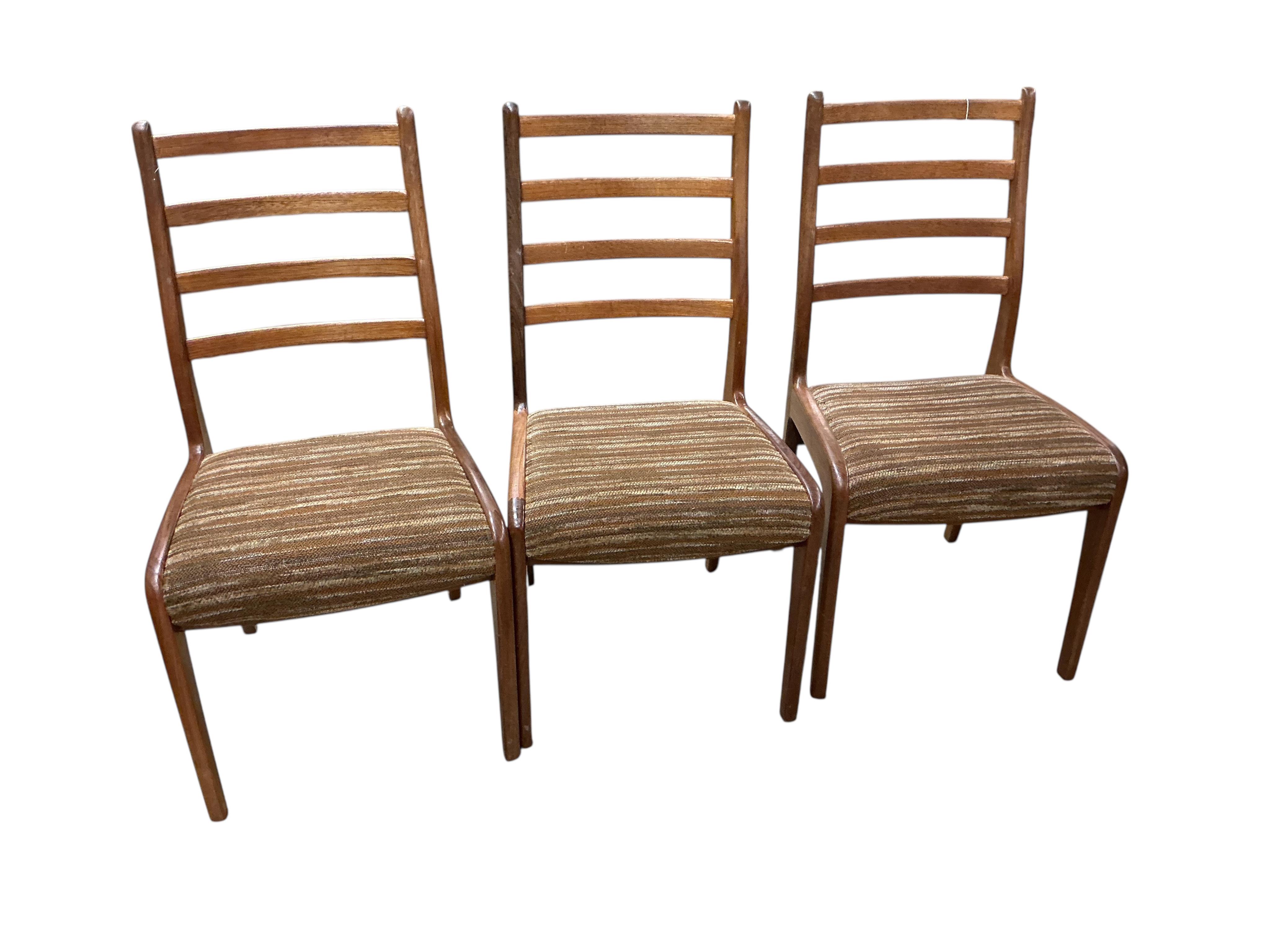 A mid century G plan teak extending dining table, width 162cm, depth 106cm, height 72cm together with a set of six chairs